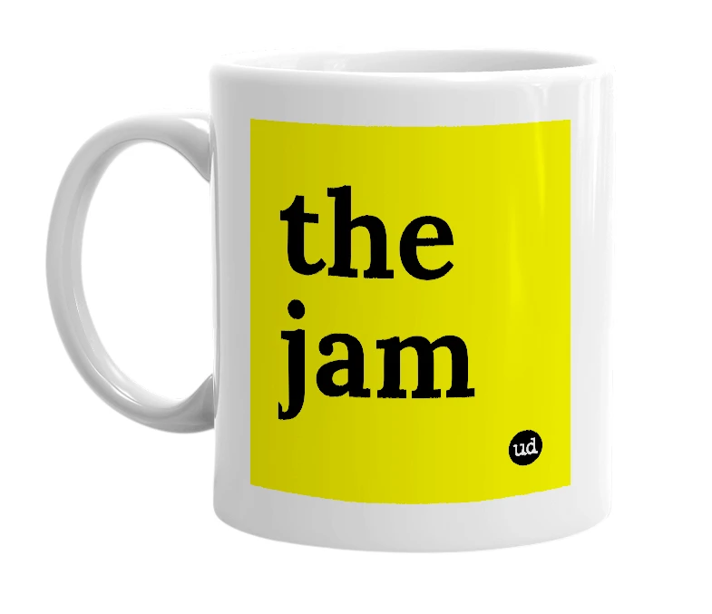 White mug with 'the jam' in bold black letters