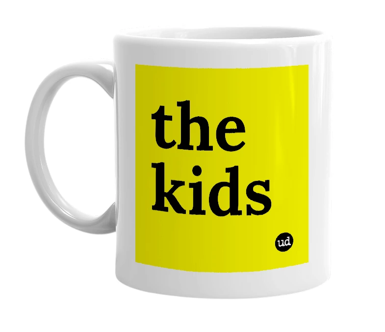 White mug with 'the kids' in bold black letters