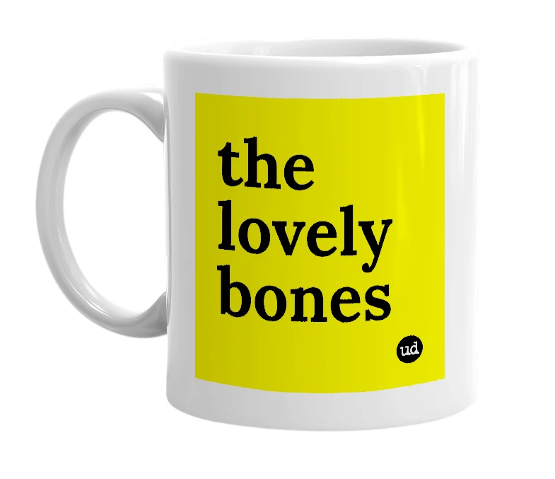 White mug with 'the lovely bones' in bold black letters