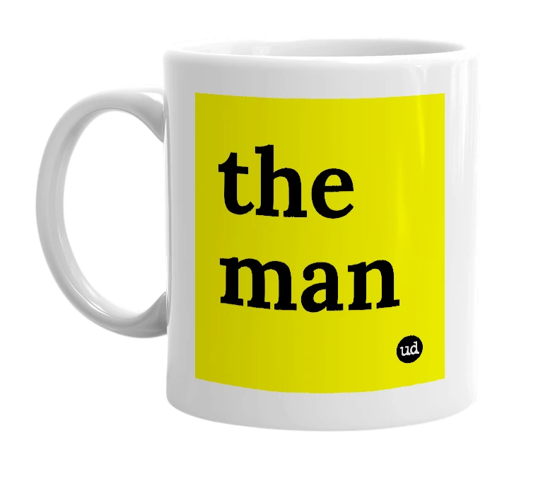White mug with 'the man' in bold black letters