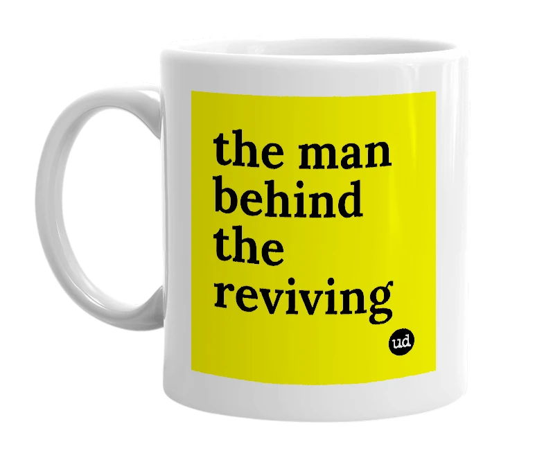 White mug with 'the man behind the reviving' in bold black letters