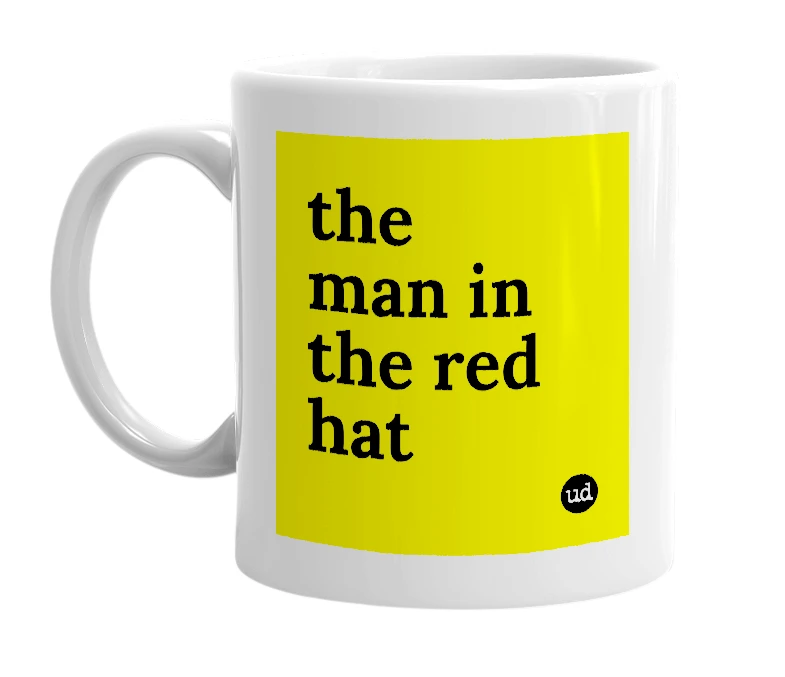 White mug with 'the man in the red hat' in bold black letters