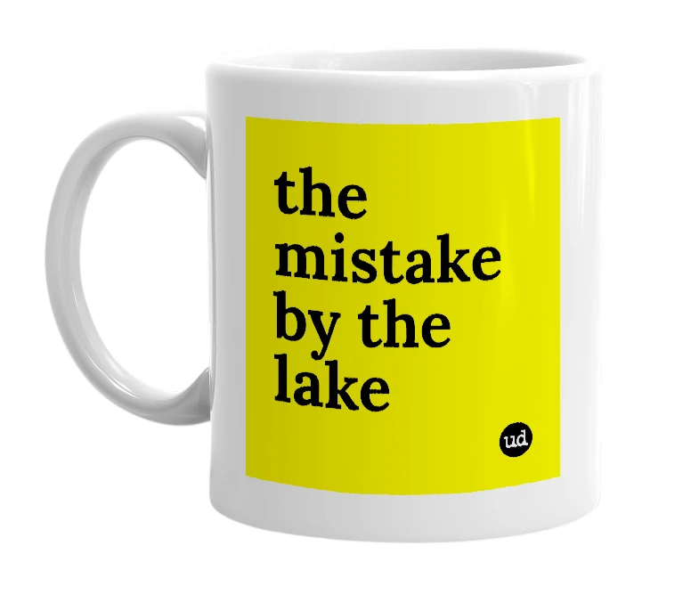 White mug with 'the mistake by the lake' in bold black letters