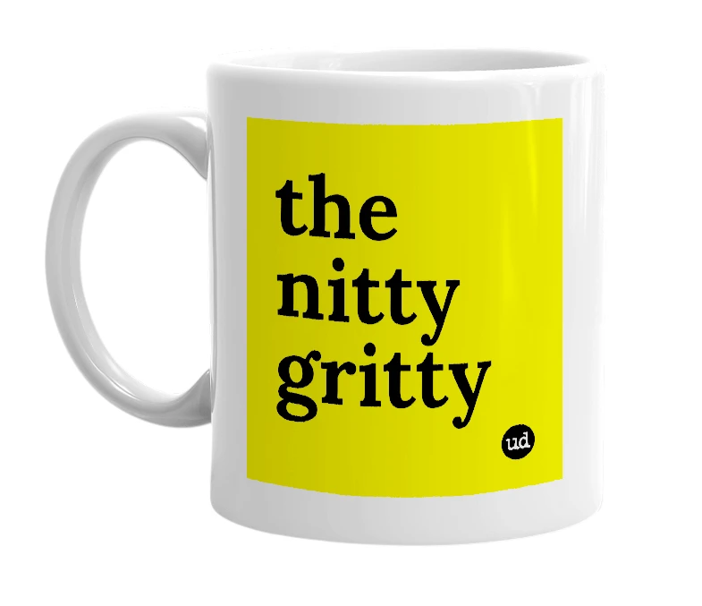 White mug with 'the nitty gritty' in bold black letters