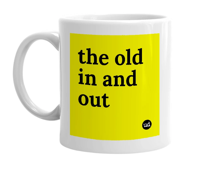 White mug with 'the old in and out' in bold black letters