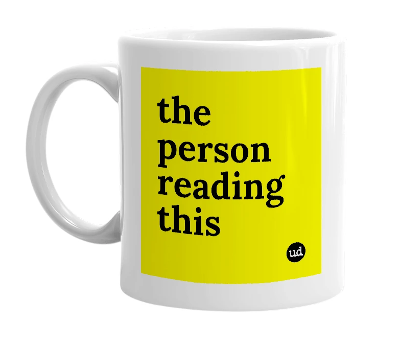 White mug with 'the person reading this' in bold black letters