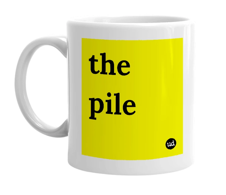 White mug with 'the pile' in bold black letters