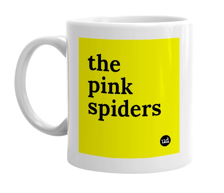 White mug with 'the pink spiders' in bold black letters