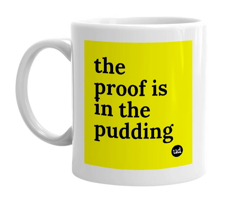 White mug with 'the proof is in the pudding' in bold black letters