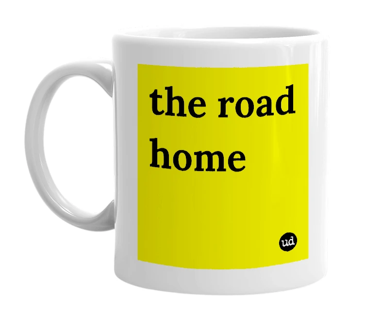 White mug with 'the road home' in bold black letters