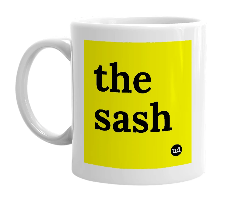 White mug with 'the sash' in bold black letters