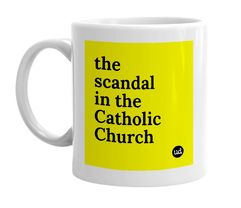 White mug with 'the scandal in the Catholic Church' in bold black letters
