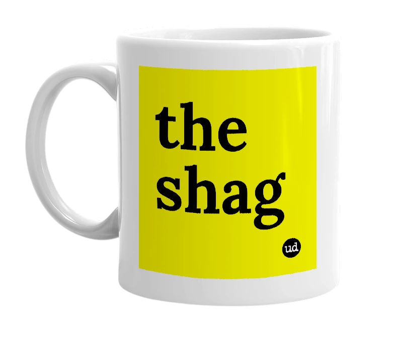 White mug with 'the shag' in bold black letters