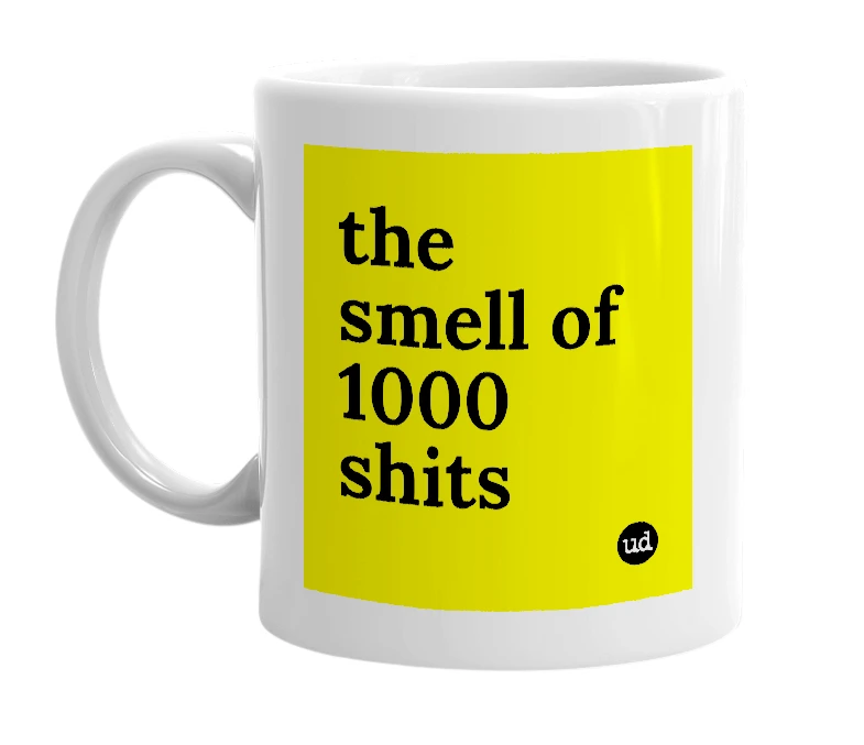 White mug with 'the smell of 1000 shits' in bold black letters
