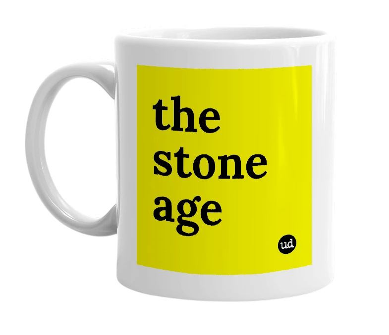 White mug with 'the stone age' in bold black letters