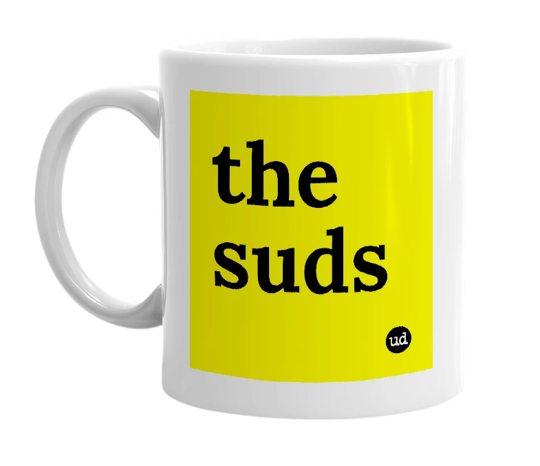 White mug with 'the suds' in bold black letters