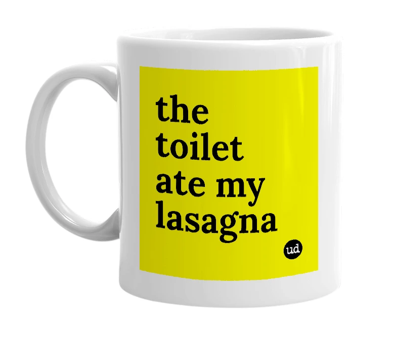 White mug with 'the toilet ate my lasagna' in bold black letters