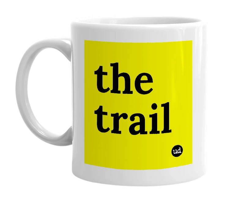 White mug with 'the trail' in bold black letters