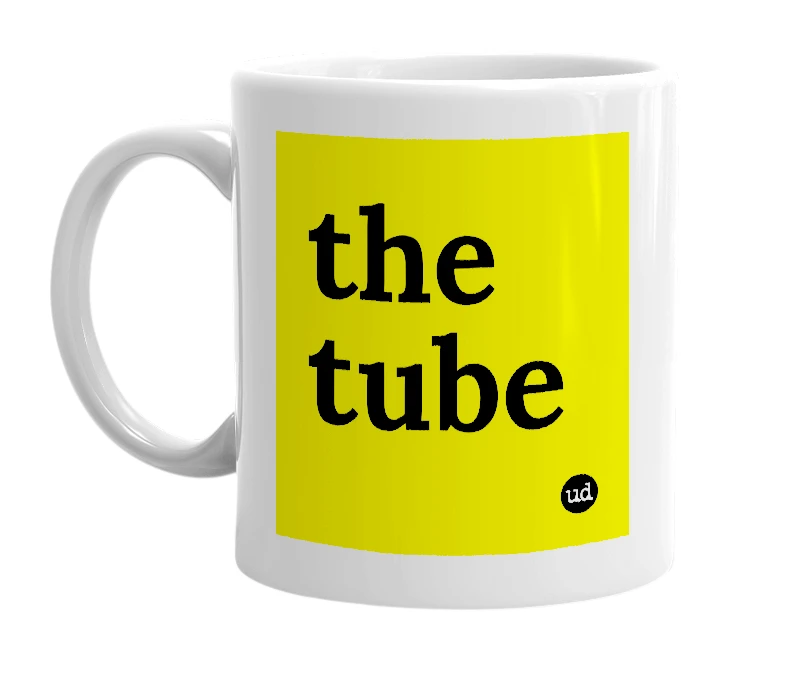 White mug with 'the tube' in bold black letters