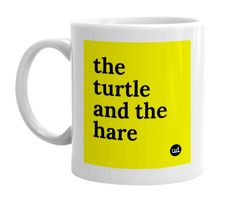 White mug with 'the turtle and the hare' in bold black letters