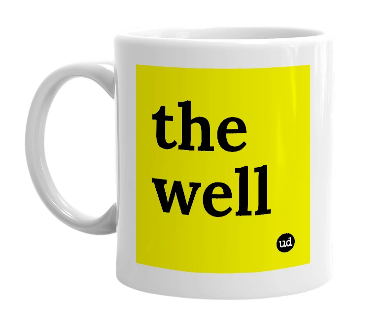 White mug with 'the well' in bold black letters
