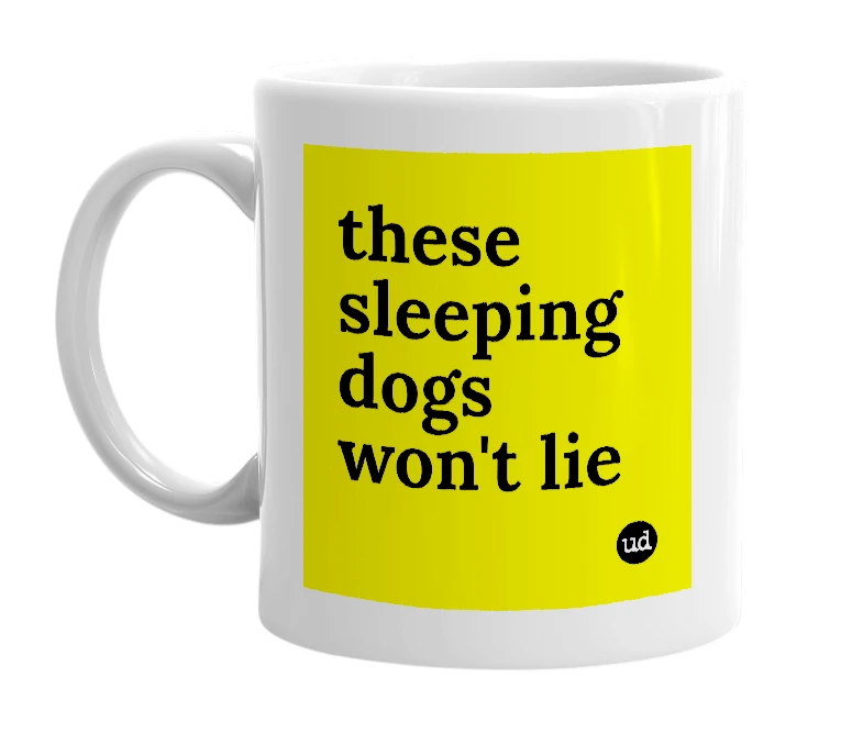 White mug with 'these sleeping dogs won't lie' in bold black letters