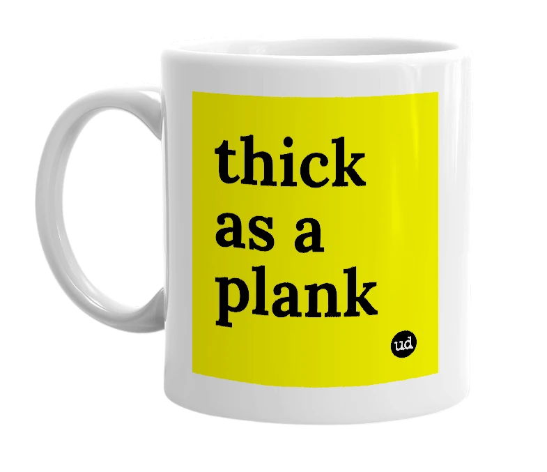 White mug with 'thick as a plank' in bold black letters