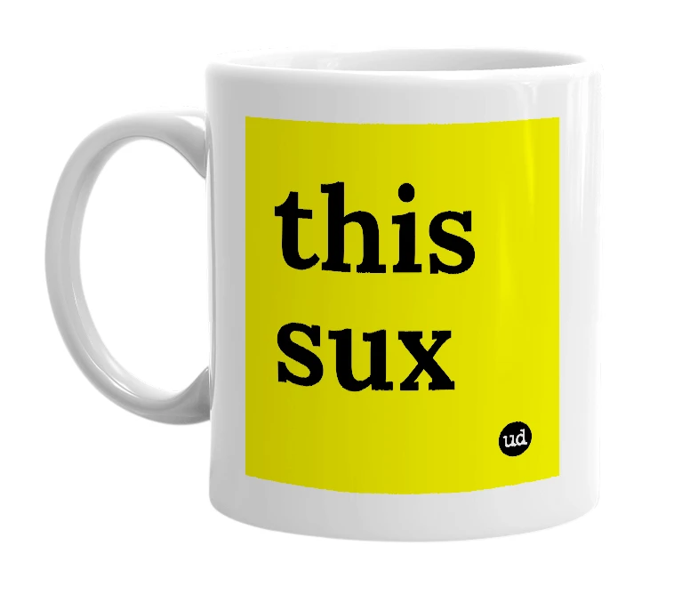 White mug with 'this sux' in bold black letters