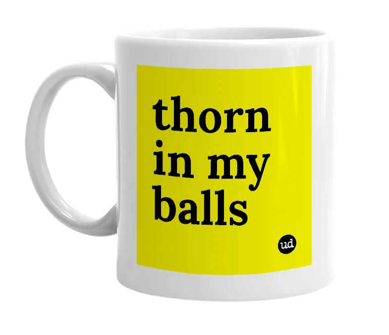 White mug with 'thorn in my balls' in bold black letters