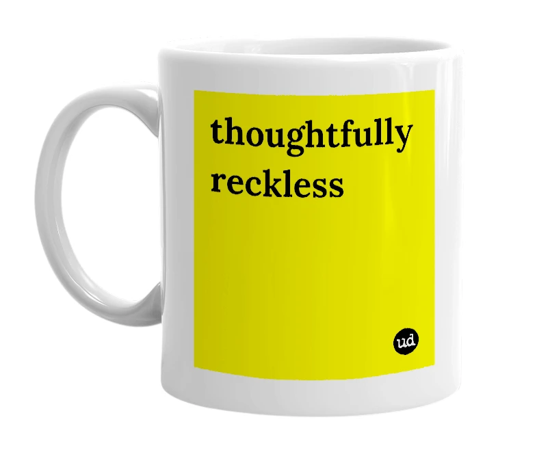 White mug with 'thoughtfully reckless' in bold black letters