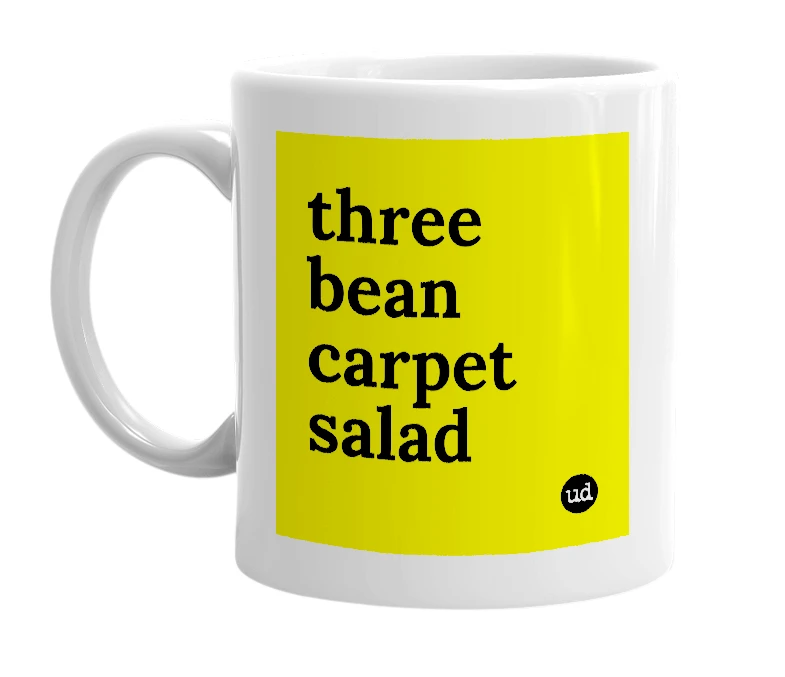 White mug with 'three bean carpet salad' in bold black letters