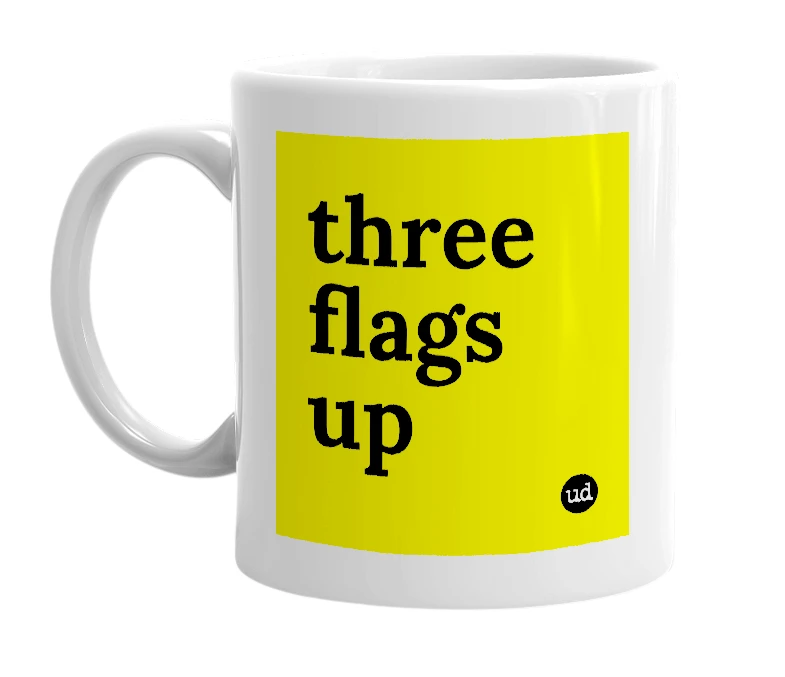 White mug with 'three flags up' in bold black letters