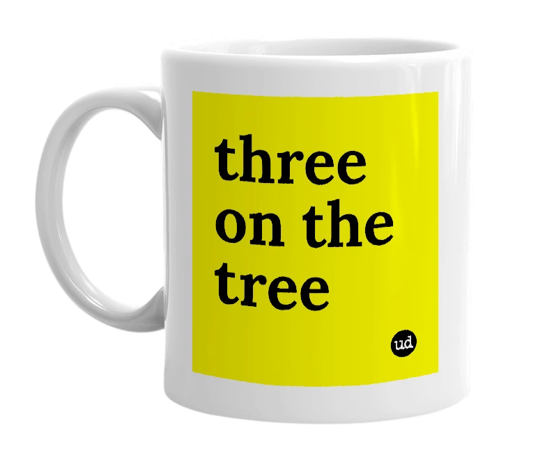 White mug with 'three on the tree' in bold black letters