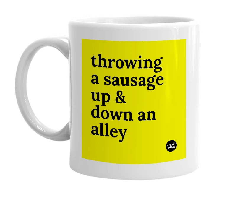 White mug with 'throwing a sausage up & down an alley' in bold black letters