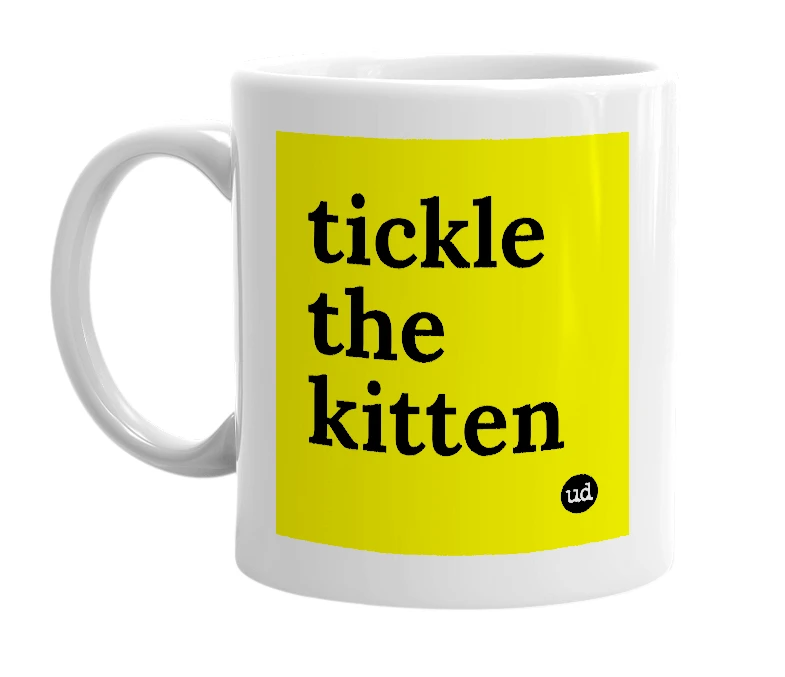 White mug with 'tickle the kitten' in bold black letters