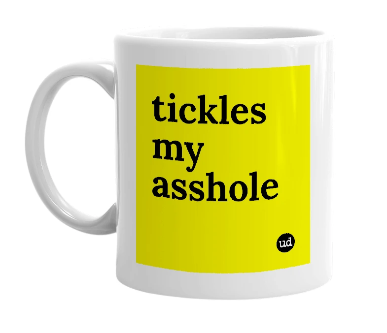 White mug with 'tickles my asshole' in bold black letters