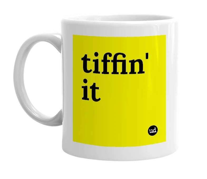 White mug with 'tiffin' it' in bold black letters