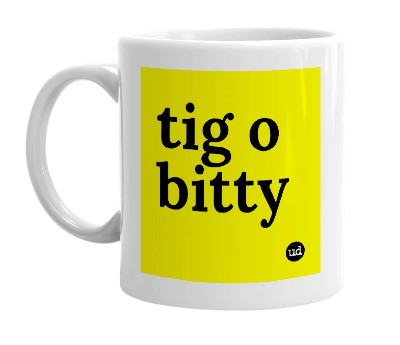 White mug with 'tig o bitty' in bold black letters