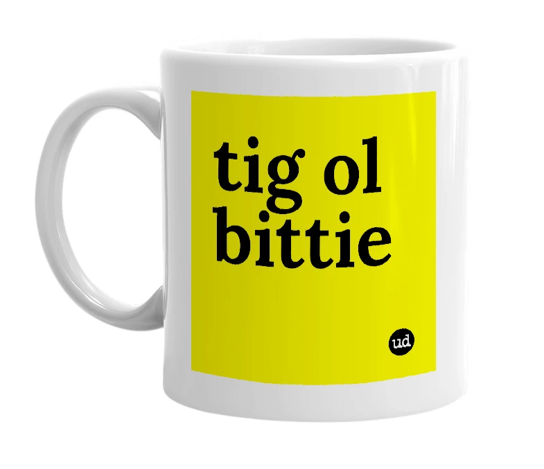 White mug with 'tig ol bittie' in bold black letters