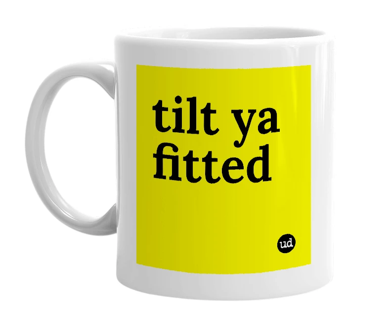 White mug with 'tilt ya fitted' in bold black letters