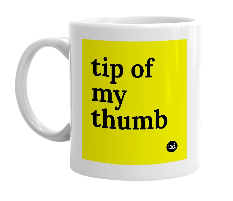 White mug with 'tip of my thumb' in bold black letters