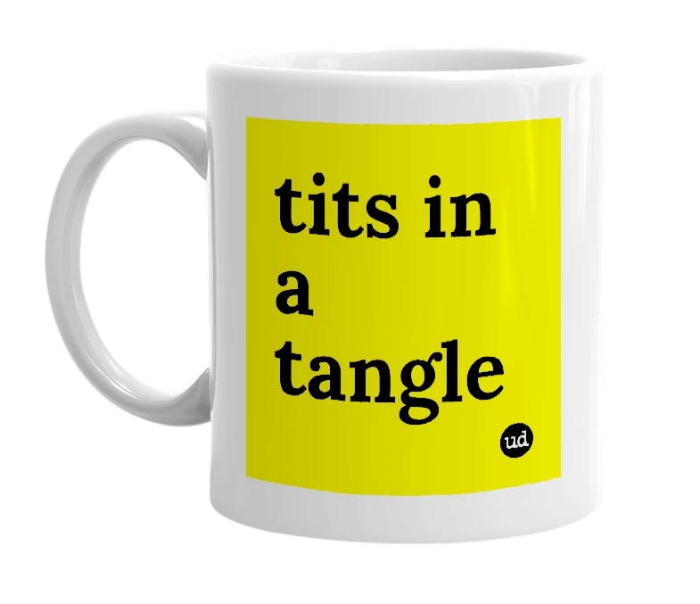 White mug with 'tits in a tangle' in bold black letters