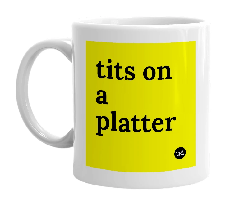 White mug with 'tits on a platter' in bold black letters
