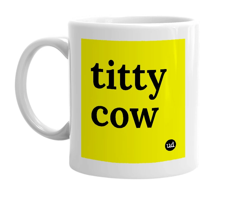 White mug with 'titty cow' in bold black letters