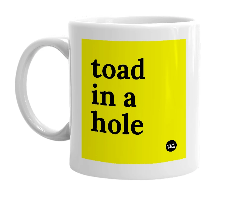 White mug with 'toad in a hole' in bold black letters