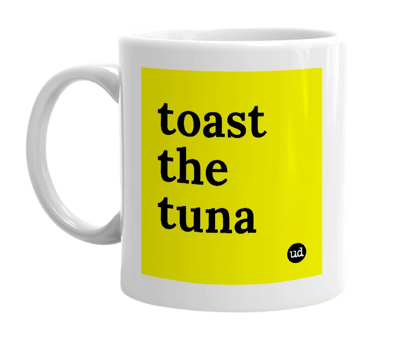 White mug with 'toast the tuna' in bold black letters