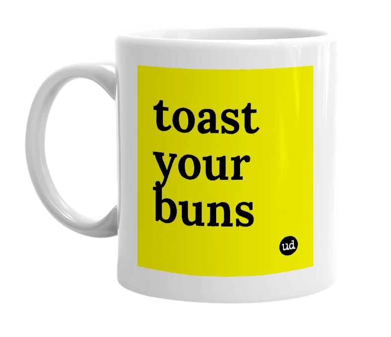 White mug with 'toast your buns' in bold black letters