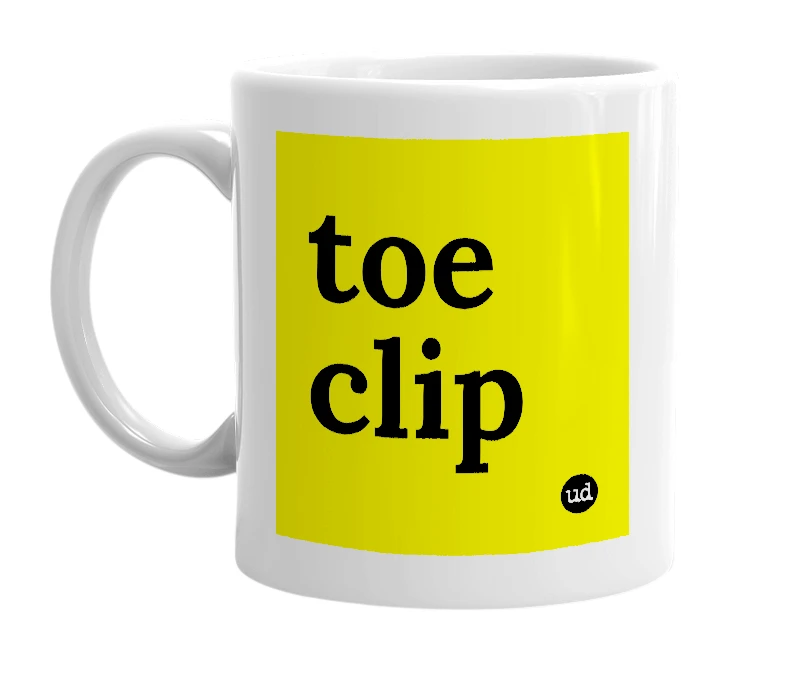 White mug with 'toe clip' in bold black letters
