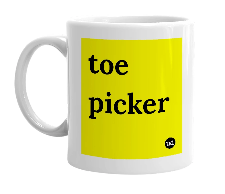 White mug with 'toe picker' in bold black letters