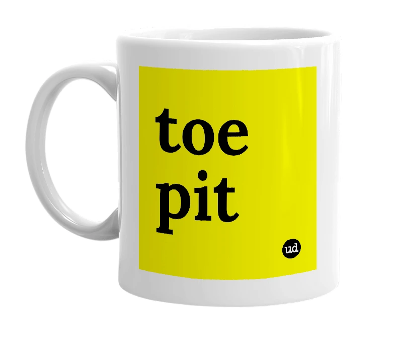 White mug with 'toe pit' in bold black letters